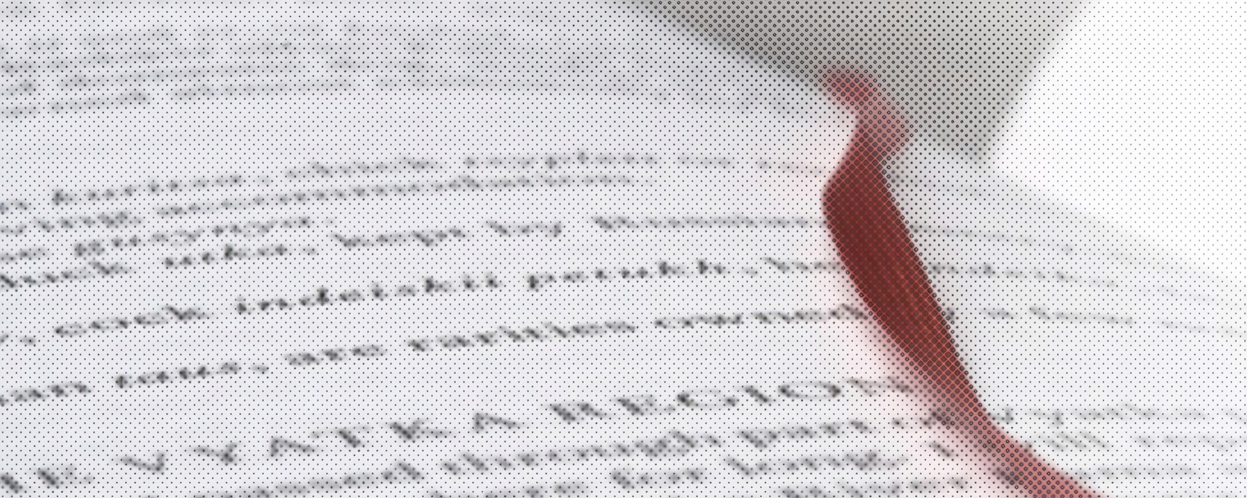 Open book pages with a red pencil