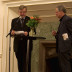 Björn von Sydow presents the dinner speaker Gunnar Broberg.