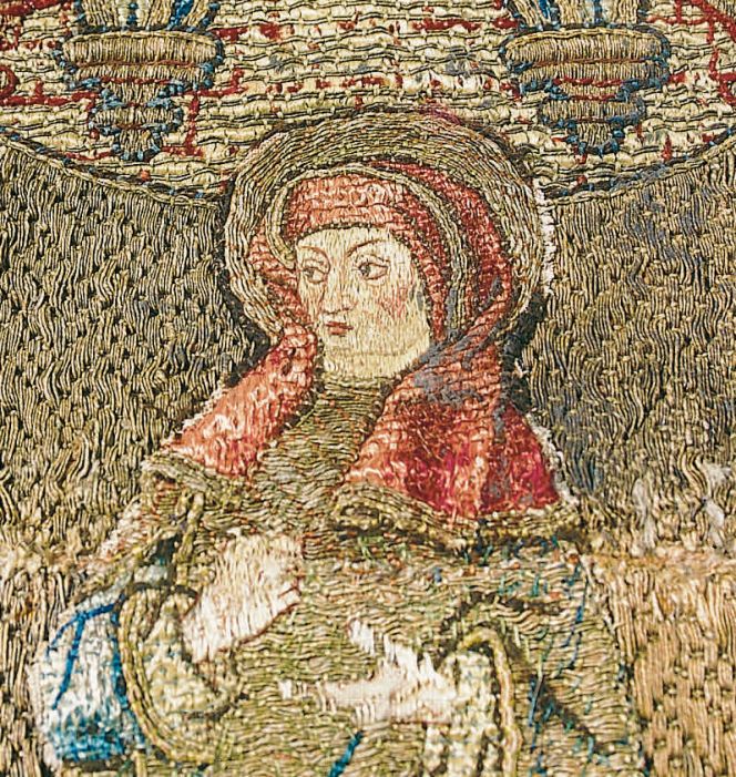 This close-up detail of a fragmented cross depicting the abbess Brigida from Ireland –  originally decorating a chasuble – is one representative example of designs from the highly skilled professional embroiderers in Flanders workshops. The work originate from c.1500. Photo: The IK Foundation, London.