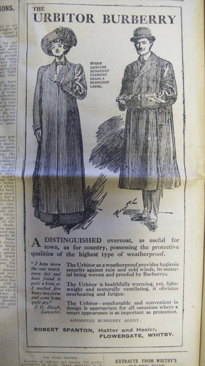 Waterproof coats of Garbadine fabric and the so-called Urbitor which was lightweight as well  as weatherproof were popular materials for outdoor garments in the early 20th century. The  Hatter & Hosier Robert Spanton on Flowergate of Whitby advertised Burberry’s waterproof coats in the  local Whitby Gazette, in this notice from 1912 he also stated that the firm by now was an  ‘Appointed Burberry Agent’. (Whitby Museum, The Library). Photo: Viveka Hansen.