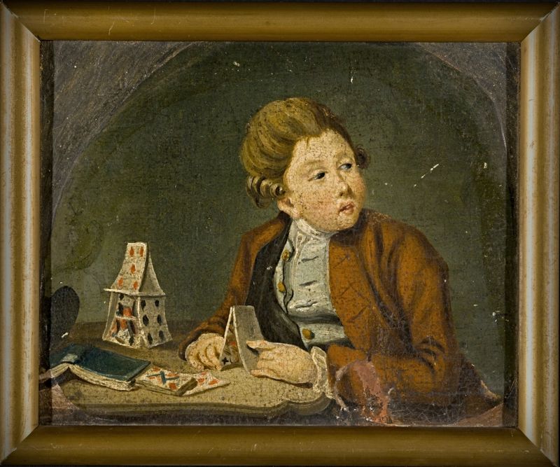 ‘Boy building card houses’ in the 1780s or 1790s, when he probably was supposed to read judging by his watchful gaze and then turned upside-down book. This unidentified wealthy boy was dressed in a brown broadcloth or a silk frock coat, a half-unbuttoned whitish-coloured waistcoat, a white shirt and a matching neckcloth. | Oil on canvas by Pehr Hilleström (1732-1816). (Courtesy: The Nordic Museum, Sweden. No: NM.0252035. DigitaltMuseum).