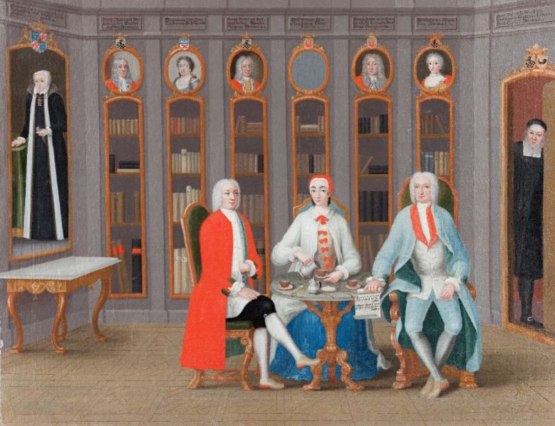A somewhat later example dated to circa 1740, portrayed ’The Stenbock family in their library at Rånäs’, situated close to Stockholm in Sweden. This household library interior is enlightening from several perspectives. The global cultures, luxury consumption and affluent living conditions are partly demonstrated in a similar way as on the image above. All three individuals wore robes/modified banyan style garments, for warmth in their high-ceiling library. In particular the lady’s floor-length white garment, tied with a red ribbon at the neck, seems to have been made in a comfortable wide model. The gentlemen’s lined garments were more close-fitting in the style of a collarless coat with deep cuffs. Further attributes of wealth include: drinking of chocolate or coffee, seated on high-back upholstered chairs in front of decorated bookshelves at the same time as their ancestors’ portraits looked down on the daily life. Whilst the clergyman who peeked into the room, probably symbolised their Christian devoutness equally as he may have kept an observing eye, so the noble family stayed within moderation even for their higher strata of society. | Oil on canvas by Carl Fredrik Swan (1708-1766). (Courtesy: Skokloster Castle, Sweden. No: SKO3053. Wikimedia Commons).