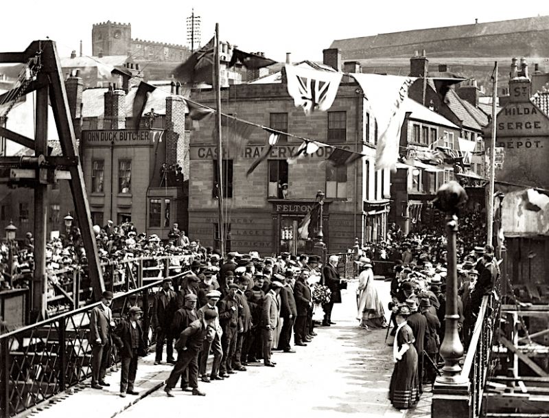 Detailed study by an unknown photographer showing the opening of the Swing Bridge in 1909, leading up to Bridge Street. This area was a “textile district” for the whole advertising period from 1855 to 1914 – and earlier – including several of the long-established draperies of Whitby. (Courtesy of: Whitby Museum, Photographic Collection).