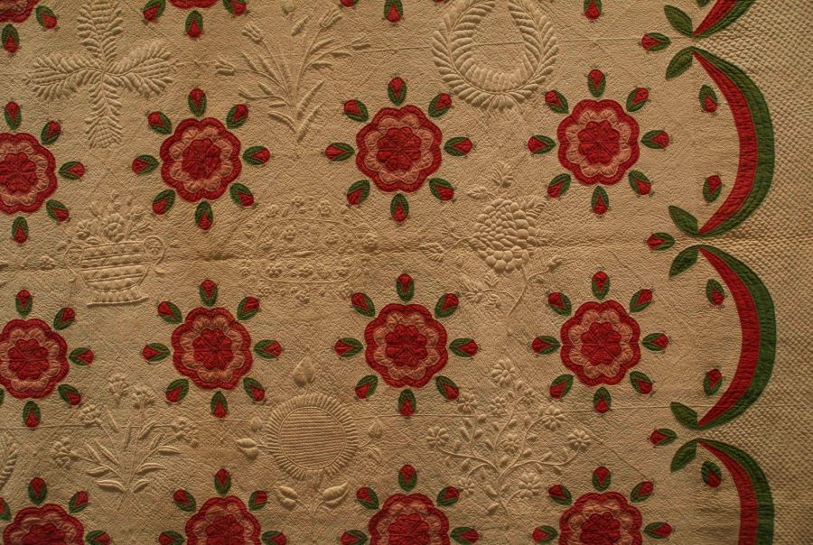 At the time for a visit at the American Folk Art Museum, a number of exquisitely made quilts were on display.  This close-up shows a particularly beautiful example from Kentucky dating c. 1850 – a so-called “Whig Rose  and Swag Border Quilt” of cotton, made by unidentified slaves, for Mrs. Marmaduke Beckwith Morton  (1811-1880). If it had not been for a handwritten label pinned at the back noting that female slaves of the  household had stitched the quilt, it had been assumed that the lady of the house had been the hand behind  this exquisite workmanship. The exhibition also emphasised: ‘Until fairly recently, such finely stitched quilts  made in the South were typically attributed as the work of the mistress of the household. In truth many were  made by female slaves with specialised sewing skills who worked in the home rather than the fields’. (American  Folk Art Museum, New York, no 2012.8.1). Photo: The IK Foundation, London.