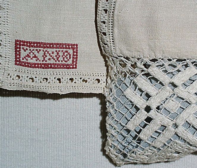 A second close-up detail of the same pillow-case, additionally showing a monogram in red cross stitch  and net embroidery. Made in Borrby parish, Ingelstad district, Skåne, Sweden in 1838. (Courtesy of:  The Nordic Museum, detail of NM.0098458, Creative Commons).
