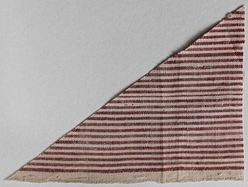 The Anders Berch Collection, which forms a unique accumulation of 18th century fabric samples has interesting comparisons with the auction catalogue dating 1752. This collection of almost 1.700 textile samples– including East Indian fabrics of various kinds – has been scientifically examined in connection with the cataloguing and publication of the material at the Nordic Museum in Stockholm. As the Uppsala professor Anders Berch’s (1711-1774) aim with the large collection was educational, it is regarded as most probable that these samples were manufactured from 1736 up to his death in 1774. This particular preserved gingham cotton sample is of comparable quality, design and origin as: ‘Lot 1556. 1 piece of red striped gingham from Suratte, 11 aln long and 1 1/12 wide’ listed in the auction catalogue from the East India ship ‘Götha Leijon’. See the full list of sold pieces of cotton below. (Courtesy: The Nordic Museum.… NM.0017648B:64A. DigitaltMuseum).  