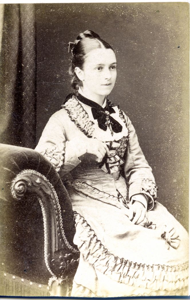 There are no known contemporary photographs preserved of the premises of Robert Gray & Sons at Silver Street in the West Cliff area of Whitby, but as a connection to furnishing textiles, this lady was portrayed a few streets away in a studio in Khyber House during the 1870s. It looks as if she is sitting on a chaise-longue, covered with strongly-coloured velvet cloth with a decorative hanging fringe. A popular look for drawing-room furniture at the time and furthermore ‘velvet’ was often mentioned as a textile material for furnishing in the auction announcements. (Courtesy of: Whitby Museum, Photographic Collection, 2002/13.16).