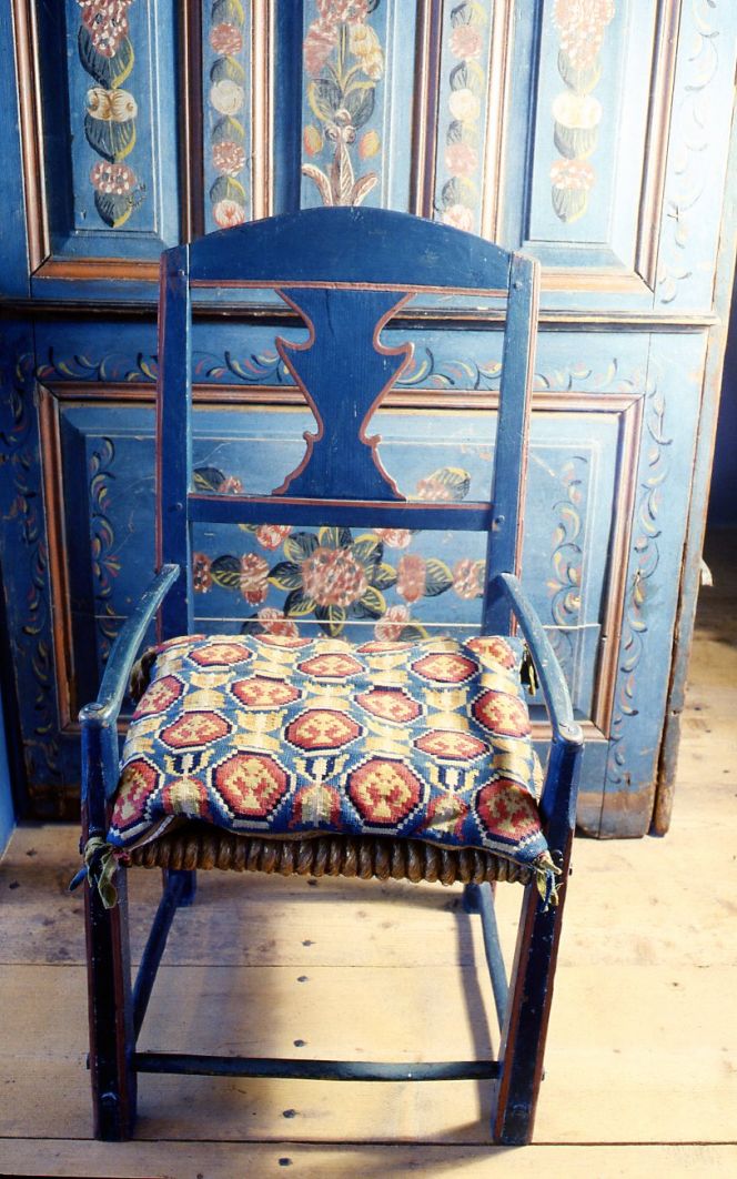  Chair with square sized cushion woven in double interlocked tapestry from Villands district, Skåne.  (Owner and museum interior: Malmö museums, photo: The IK Foundation, London).