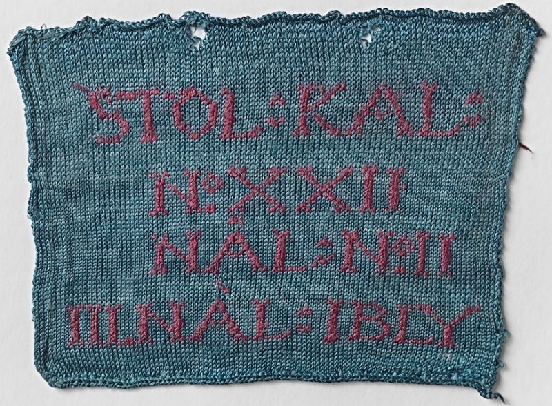 Even if machine-knitted garments still were quite rare in mid-18th century Sweden, it existed and in particular in use for luxurious very fine silk stockings. The technique is illustrated here with one of six machine-knitted samples, originating from an unknown Swedish manufacturer, circa 1740s-1760s. This knitted sample of silk, was done in stocking stitch with a knitted letters in a contrasting colour. According to the Nordic Museum research group, the knitted letters had the following meaning: ‘STOL means stocking loom. KAL plus Roman numeral means the calibre number and thus indicates the fineness of the machine. III NÅL IBLY means three needles per lead. Roman numeral II means two needles per lead. Only those looms with three needles per lead were considered to produce fine quality.’ (Courtesy: Nordic Museum, Stockholm. No. NM.0017648B.145. Digitalt Museum).