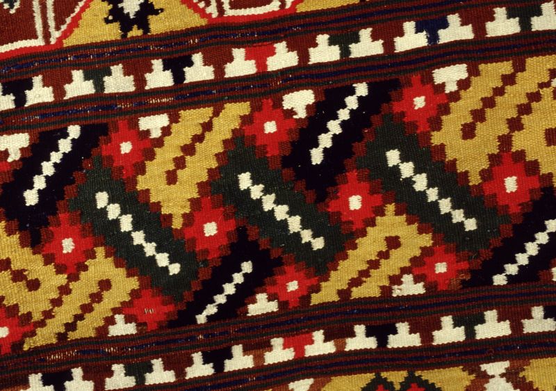 Close-up detail of an undated rölakan bench cover, in alternating wide and narrow T-shaped borders. This is an example of the typical design of southeastern Skåne from the late 18th century up to circa 1850. (Collection: Helsingborg Museum, Sweden. NO. 417-40, part of textile). Photo: The IK Foundation, London.