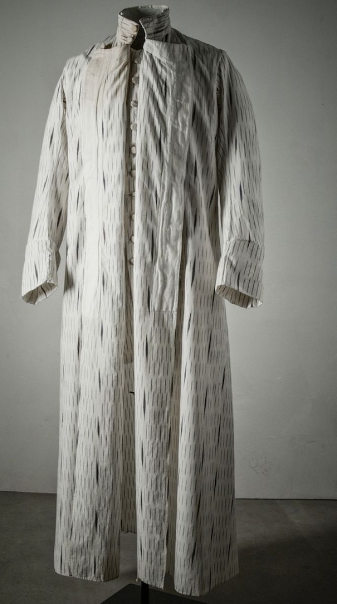 The fine cotton quality of ikat weaving used for this full-length 18th century banyan with matching waistcoat, has been identified by historian Lena Rangström as originating from India. Due to the included British East India Company bale mark (see image below), it is evident that the fabric or maybe even the ready made garments had been exported via this trading company from India to Britain. In some unknown way the banyan and waistcoat ended up in Sweden, probably via some well-to-do visitor to London during the 1770s and were brought back on his return journey home. (Courtesy of: The Nordic Museum…NMA.0065412).