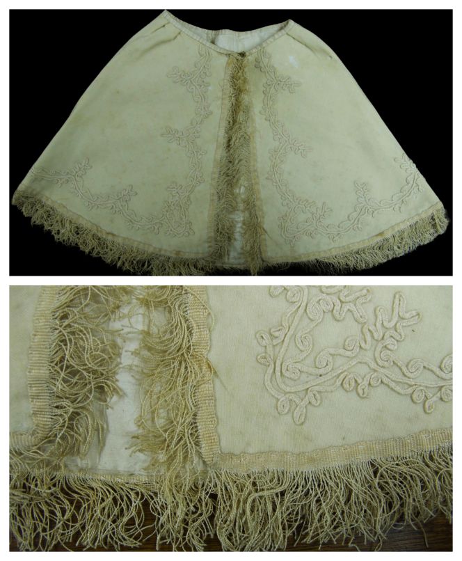The collection also includes two christening garments that would have been especially suitable during the colder months to keep the baby warm on the way to and from the church. This illustrated item is a baby cape in fine cream-coloured wool, decorated with a silk fringe, lined with matching silk, and fastened at the neck with a hook. The decorations on this entirely hand-sewn garment feature a slender silk cord sewn into a complex festoon-shaped motif. It can be dated to the 1850s or 1860s, based on the stitching and decoration details. (Collection: Whitby Museum…, Costume Collection, GBS14). Photo: Viveka Hansen, The IK Foundation.