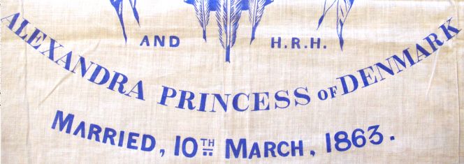 Close-up depiction of a tray cloth to celebrate the marriage of H.R.H. Albert Edward to H.R.H.  Alexandra in 1863. Printed in blue on unbleached cotton, 75×63 cm in size. (Owner:  Whitby Museum, 2002/39.2). Photo: The IK Foundation, London.
