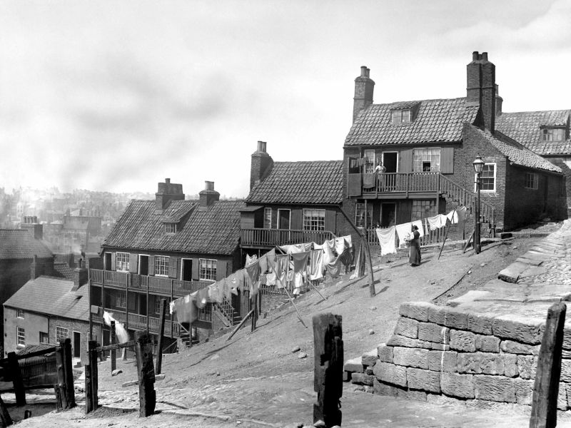 This second photograph by Frank Meadow Sutcliffe showing a woman hanging up washing at Boulby Bank in Whitby, an area where many laundresses lived and worked according to repeated censuses. (Courtesy: Whitby Museum, Photographic Collection, Sutcliffe 13-48).