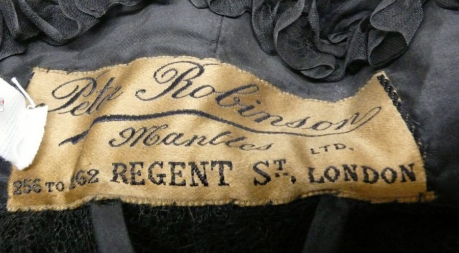 Label on a cape, from the mourning house ‘Peter Robinson Mantles LTD…’ in London, as described below. (Whitby Museum, Costume Collection, GMB2). Photo: Viveka Hansen.