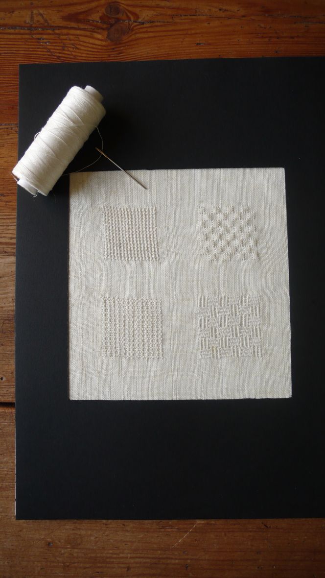 The attempt to reproduce four whitework embroidery styles on linen (14 threads/cm) with fine 2-ply linen thread (a type of linen thread also used for making hand-made bobbin laces). Top left: a half cross stitch, top right: shadow stitching, bottom left: mock leno effects and bottom right: “basket motif”. Photo and embroidery: Viveka Hansen.