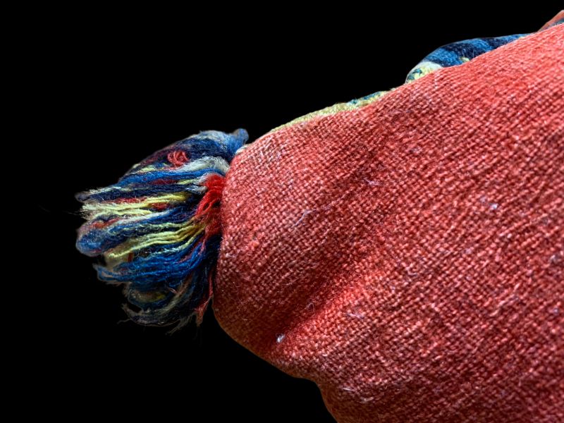 The back was not intended to be seen, and it was more robust and durable if cattle hair was mixed into the yarn. For economic reasons, the expensive red and blue colours were seldom used for the backs – but this beautiful cushion is one of the exceptions, with its madder red tabby woven broadcloth. Stronger shades were otherwise occasionally used for smaller areas and narrow stripes. Of the 1,693 inventoried textiles, 563 still have their original backs. These are mainly cushions and, to a lesser extent, bench covers. Over the years, the backs have been exposed to significant wear and tear and have sometimes worn to pieces. The rest have been thrown away. Now and then, only fragments remain on a cushion. However, this travel cushion is still well-preserved. (Private ownership). Photo: The IK Foundation.