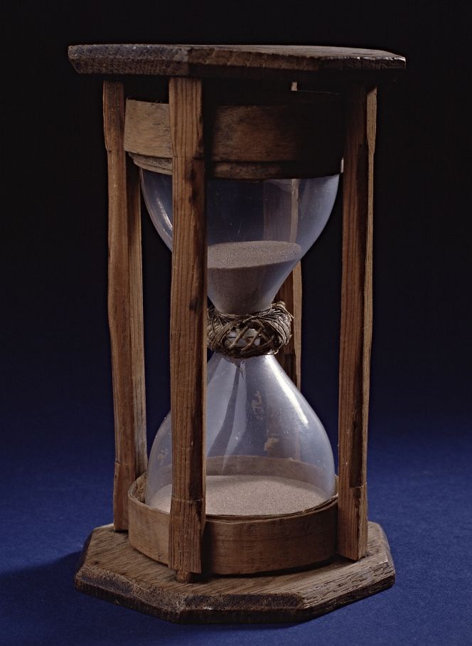 A well-preserved 18th-century half-hour sandglass, in a model, twisted around the central part with hemp yarn to keep the two glasses together. The most important use of this tool was to keep time during the changing of watch on board the Swedish East India ships, which took place after eight such glasses had run down – in other words, after four hours. (Courtesy: The Maritime Museum, Stockholm, Sweden).