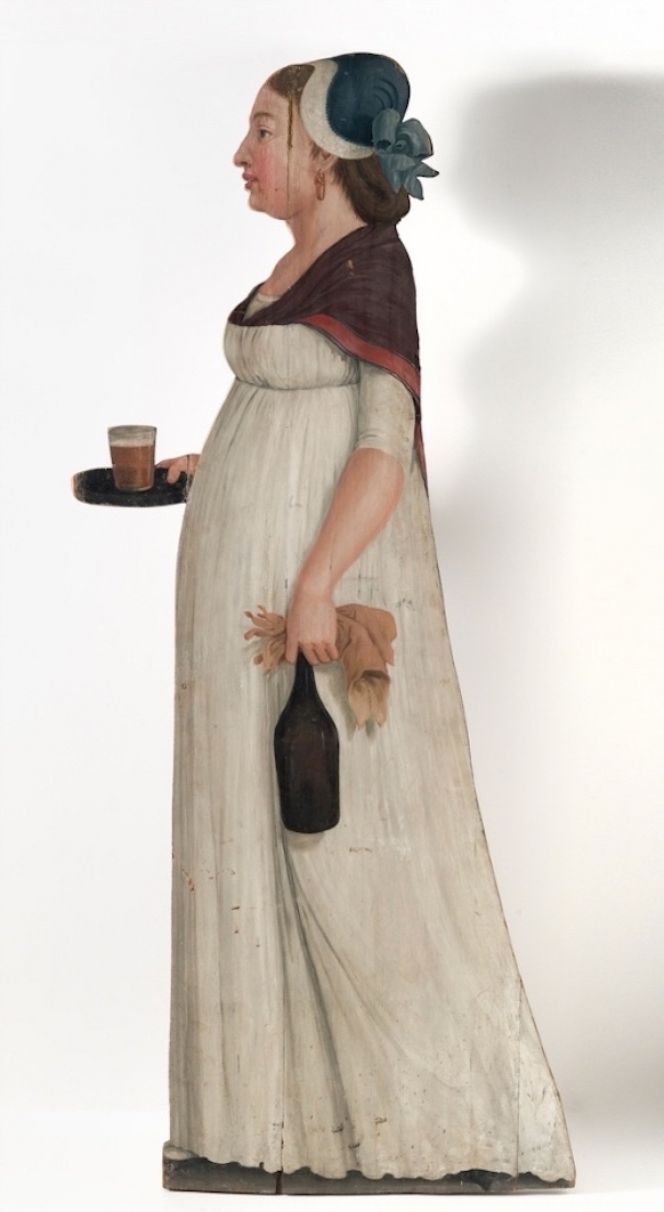 Life-size picture-board dummies were popular to place in manor gardens already in late 17th century and continued to be so during the coming century. This lady may be assumed to depict a servant of a wealthy household in the 1790s, but depictions of elegant guests, gardeners and individuals from “exotic” countries are also represented on preserved dummies of this type. (Courtesy of: Nordic Museum, Sweden. NM.0097091A-B. Digitalt Museum). 