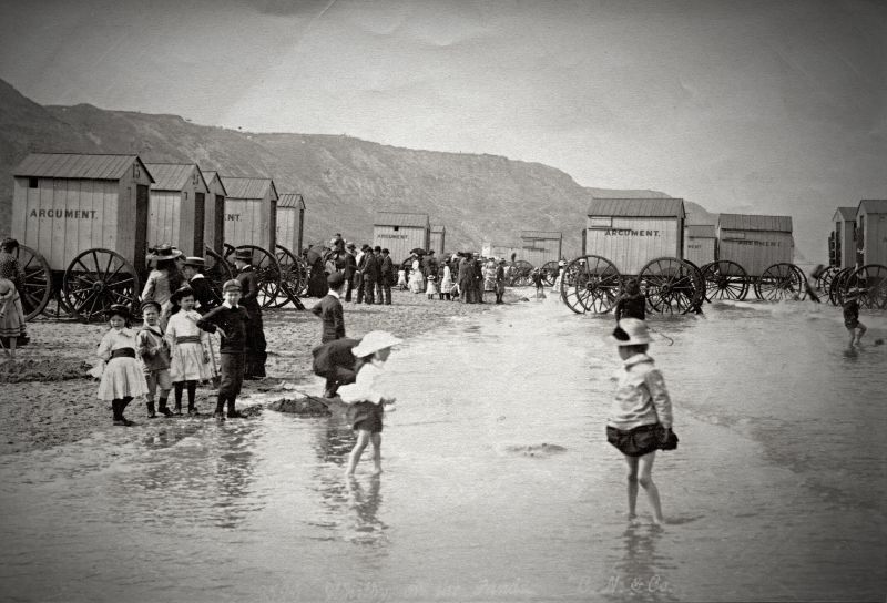 Some of the children in this 1880s picture have taken off their warm stockings to cool off in the summer warmth, possibly on a family vacation on Whitby beach. Whilst poor children in photographs taken in the town’s lanes would go barefoot all summer so as not to wear out their shoes and socks, which is evident on several of Frank Meadow Sutcliffe’s outdoor photographs. (Courtesy: Whitby Museum, Photographic Collection, C 2524, unknown photographer).