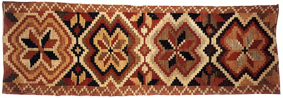 The bench cover is woven in double-interlocked tapestry – rölakan, with a typical ‘star in eight-petalled rose’ design for this geographical area. (Collection: Karlshamn Museum, Sweden. No. 2625). Photo: The IK Foundation.
