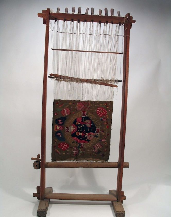 For smaller sample weaving a frame can be used, but otherwise the upright loom was the traditional model for this type of weaving. This depicted loom with its “ongoing weaving” is marked ‘Ao 1830’ ‘BOD’ and was  purchased for the Nordic Museum by the folklore researcher Nils Månsson Mandelgren in 1874 for 20  Swedish Kronor [Crowns]. As the date on the loom suggests, it was by its original owner in use from 1830  and possibly not for more than two or three decades – in Blentarp parish, Torna district, Skåne, Sweden.  (Courtesy of: Nordic Museum, Stockholm, NM.0004785, & historical facts from catalogue card. Creative Commons).