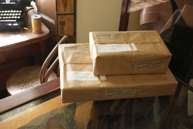 These parcels demonstrate how the ready-made garments as well as pieces of cloth could be delivered to customers  in the 1890s to early 1900s from a draper shop. Beck Isle Museum of Rural Life, Pickering; Reconstruction  of an original tailor’s shop interior from ‘Greensmith & Thackwray in Scarborough, founded in 1845. Photo:  The IK Foundation, London.