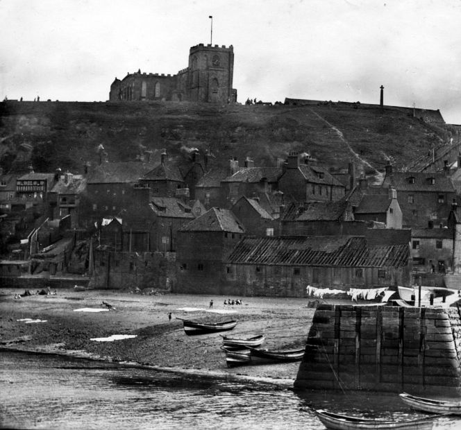 Washing laid out for drying and bleaching by the sea, which must have been a common occurrence in summer since several photographs have survived of various places along the Whitby shore with large quantities of linen laid out on the sand. Together with washing lines stretching along the beach, taken by an unknown photographer around 1890 to 1900. (Courtesy: Whitby Museum, Library & Archive, Photograph book 3/20). 