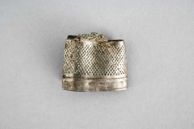 This somewhat flattened silver thimble was also unearthed in 1888 from the area Druvan, like the silver buttons above. A tool that had a very similar appearance already in the Medieval period, used either by a tailor or lady sewing her own linen garments. Dating from the first part of the 17th century or earlier. (Courtesy of: Malmö Museum, MM003591:020, Creative Commons).