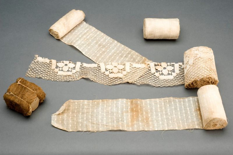 It may also be noted that clothes of every kind from the first two decades of the twentieth century are less well represented in the Whitby Museum collection. This may be because hard times during World War I (1914-1918) made it necessary to continue wearing and mending clothes bought during the easier Edwardian era together with the need for surgical dressing in military hospitals also making all type of suitable gauzy muslins and cottons from such as old clothes or curtains in great demand, which may be why relatively fewer garments have survived from that period. (Courtesy of: Via Wellcome Library: ‘Surgical dressing substitutes, Europe, 1914-1918’ by Science Museum, London, Creative Commons). 