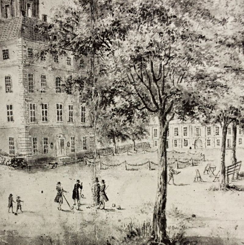 Outdoor skittle game with balls in the garden of Ängsö manor house during one summer of the 1780s. Quite a lot is going on! Visible in the picture is the imposing four-story building. As a focal point, four gentlemen dressed in ordinary upper-class fashion and additional black hats – maybe as protection from the sun. The same goes for the two small boys, slightly beside the ongoing game. Furthermore, a servant carrying a tray heads towards some high tables and chairs with refreshments. This particular manor house had been in the ownership of the Piper family since the year 1710. (Private ownership. Black and white representation of a watercolour by Isak Kjölström).