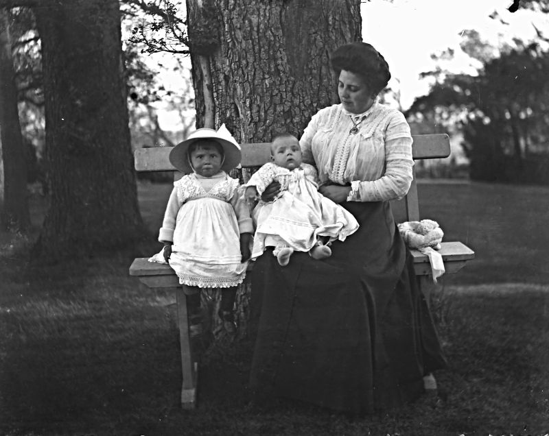 Like other local photographs from Whitby, it is possible that the baby dressed in white was photographed on the day of his or her christening. This picture from the Botham family’s collection of glass plates provides a good example of babies’ and toddlers’ clothes from around 1905, either purchased from one of the town’s shops specialising in baby clothing or made by a mother skilled at sewing, another relative, or a family servant. (Courtesy: Whitby Museum…, Photographic Collection, 2002/13.21).  