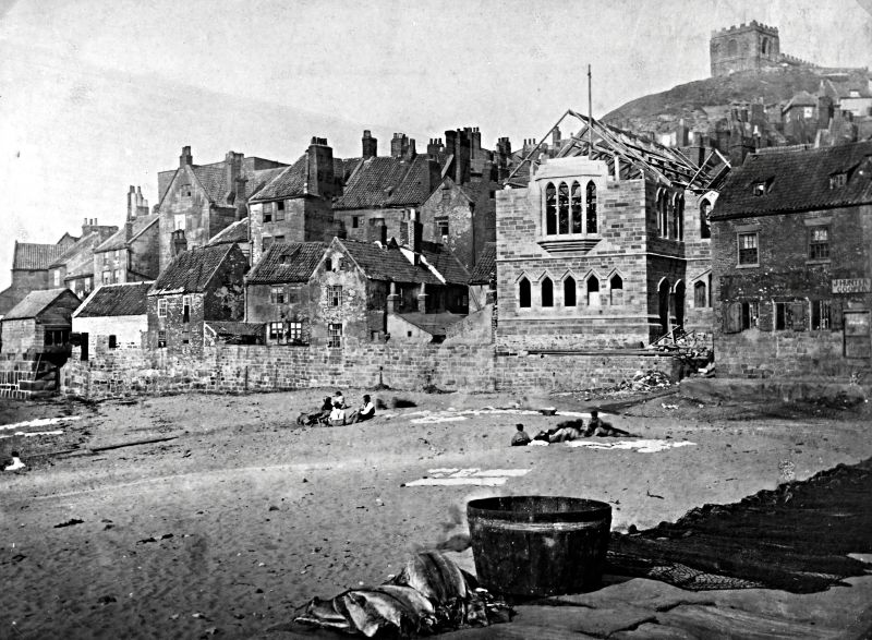 From 1890 to 1900, it still appears to have been common practice to lay out linen and cotton household textiles on the ground to dry and bleach. Among other locations, this tradition has been documented via several photographs taken along the Whitby shore in North Yorkshire, where families had such white garments and bedlinen spread out on the sand. It was also crucial to supervise one’s property, as mentioned in earlier periods, to prevent it from being trampled or, worse still, to avoid the risk of theft, since linen textiles were always somewhat valuable. In this particular image, it seems that a group of children is responsible for the whitewashing on the sand. (Courtesy: Whitby Museum, Library & Archive, UK. Photograph book 3/21, unknown photographer).