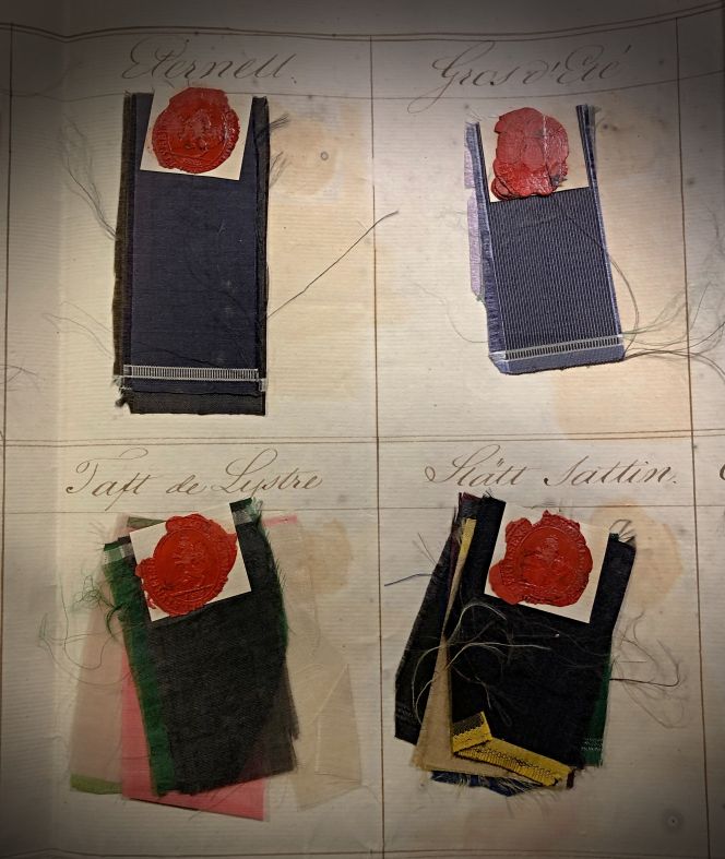 These four silk sample groups include various plain-weave types. ‘Eternell’ and ‘Gros d’ Eté’ are similar to double weft threads, particularly visible in the border close to the selvedge, but with differences in thinness. ’Gros d´Eté also visibly had been woven assisted by two shuttles – light green and black silk weft thread end on the top sample – which show in detail how the alternating single and double weft threads were used to get the striped effect.‘Taft de Lystre’ was a lightweight, almost paper-thin taffeta silk. ‘Slätt Sattin’ [Plain Satin] is finally smooth silk where the warp threads cover the weft threads altogether due to the point of design in the weaving structure. (Collection: The National Archive… See sources). Photo: Viveka Hansen, The IK Foundation.