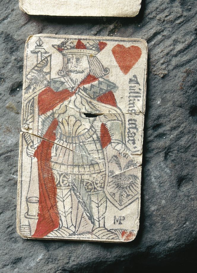 A later example which relates to a playing card from the 16th century, where the pictured monarch carries an exquisite mantle and beneath a pomegranate can be seen on his clothes. (Lund Cathedral, Sweden). Photo: The IK Foundation, London.