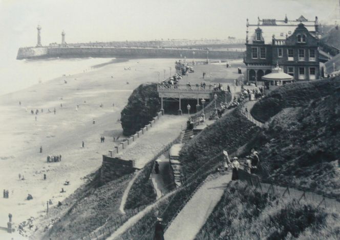 The west side beach with the cliffs, Pavilion and Whitby piers. (Courtesy of: Whitby Museum, Photographic Collection, unknown photographer).