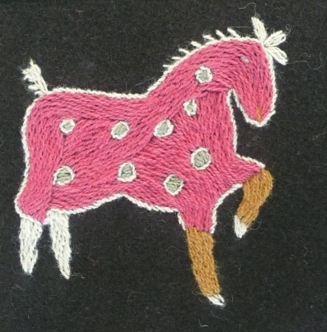 Historical reproduction of woollen embroidery, detail from bedcover (1820) Ilstorp parish,  Färs district, Skåne, Sweden. Photo and embroidery (1983): Viveka Hansen.